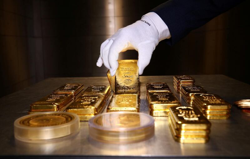 FILE PHOTO: Gold bars and coins are stacked in the safe deposit boxes room of the Pro Aurum gold house in Munich, Germany,  August 14, 2019. REUTERS/Michael Dalder/File Photo