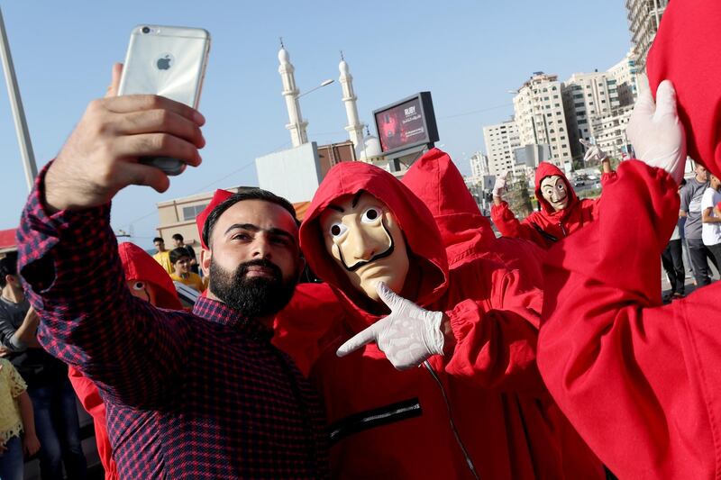 A man takes a selfie with a member of ''Bella Ciao". Reuters