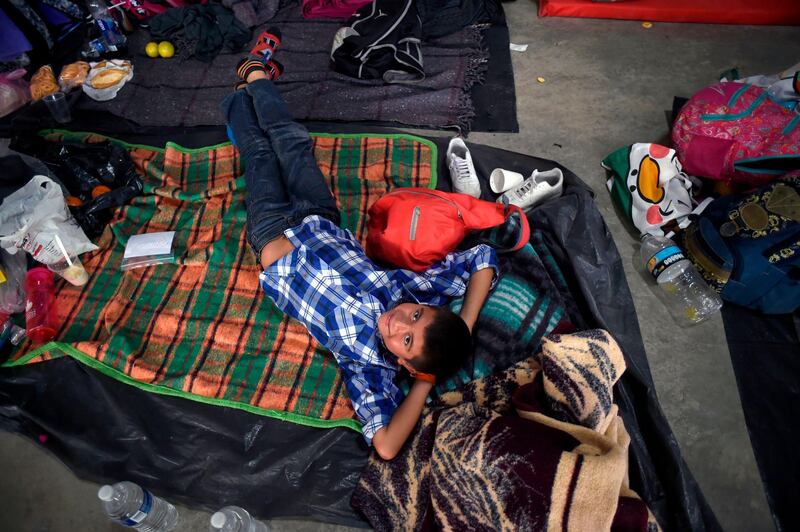 A Central American migrant boy rests at a temporary shelter in Irapuato, Guanajuato state, Mexico. AFP