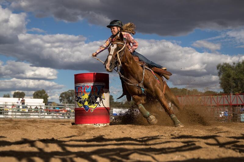 A competitor steers her mount around one of the markers in the barrel race of the Rodeo competition in Mudgee, Australia. Getty Images