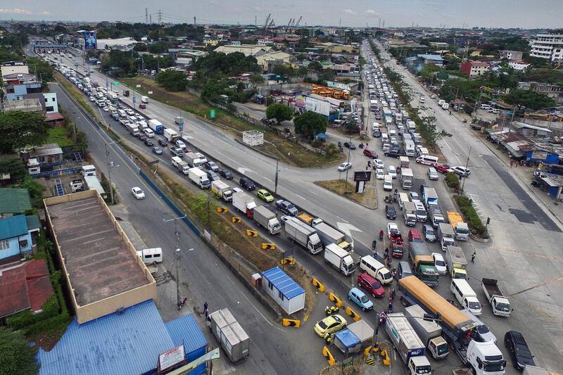 This aerial photo shows traffic congestion from vehicles waiting to clear checkpoints, part of measures to reduce the spread of the COVID-19 pandemic, before entering Manila. AFP