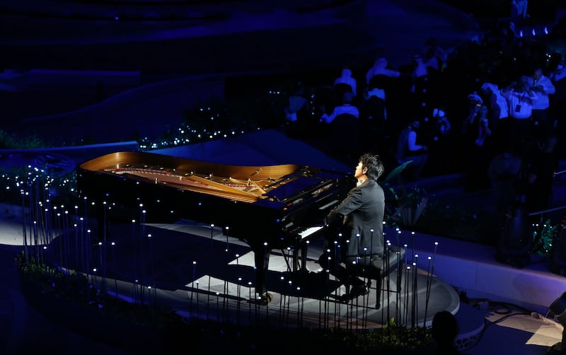 Chinese pianist Lang Lang opens the performance at Al Wasl Plaza for the Middle East's first Expo. Photo: Ali Haider / EPA