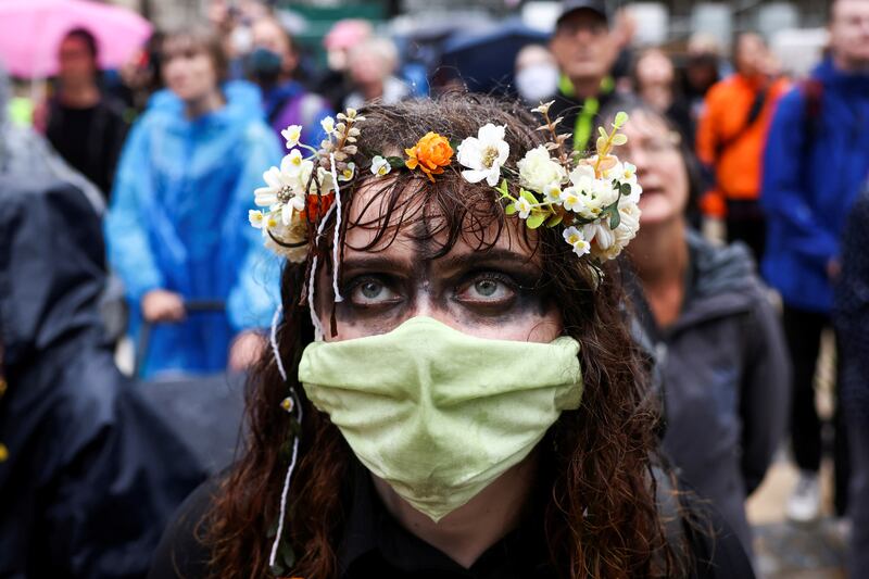 Activists climbed the outside of the headquarters of the City of London's government on Sunday as they launched a series of protests focusing on the capital's financial district. Reuters