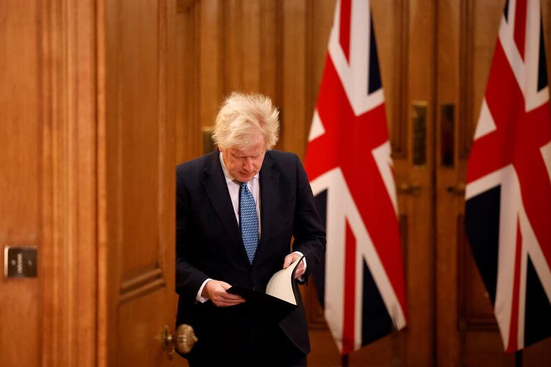 DECEMBER: Britain's Prime Minister, Boris Johnson attends a virtual press conference inside 10 Downing Street after a string of countries banned travellers and all but unaccompanied freight arriving from the UK, due to the rapid spread of a new, more-infectious coronavirus strain. Getty Images