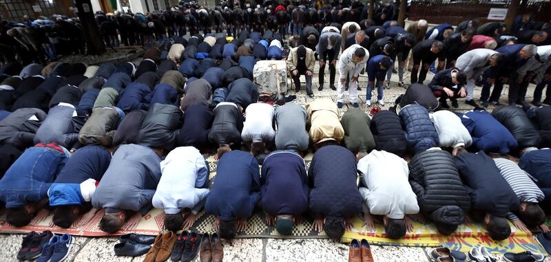 Bosnian Muslims attend morning prayers in front of the main Gazi Husrev-beg Mosque in Sarajevo, Bosnia and Herzegovina.  EPA