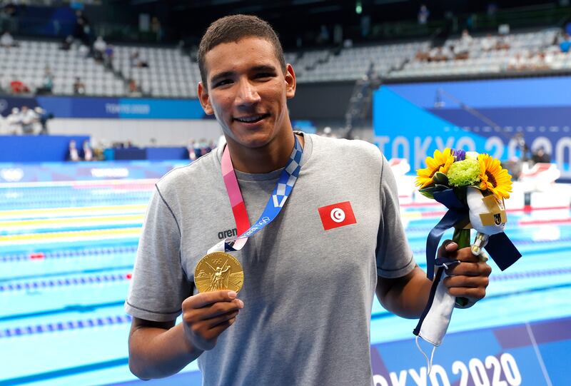 Ahmed Hafnaoui of Tunisia poses with his gold medal after winning the men's 400m freestyle final at the Tokyo Olympics. EPA