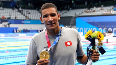 Ahmed Hafnaoui of Tunisia poses with his gold medal after winning the men's 400m freestyle final at the Tokyo Olympics. EPA