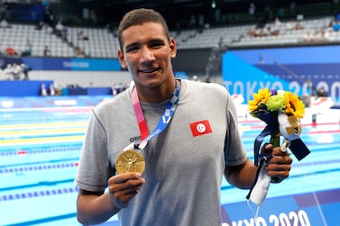 Ahmed Hafnaoui of Tunisia poses with his gold medal after winning the Men's 400m Freestyle final during the Swimming events of the Tokyo 2020 Olympic Games at the Tokyo Aquatics Centre in Tokyo, Japan, 25 July 2021.   EPA / VALDRIN XHEMAJ
