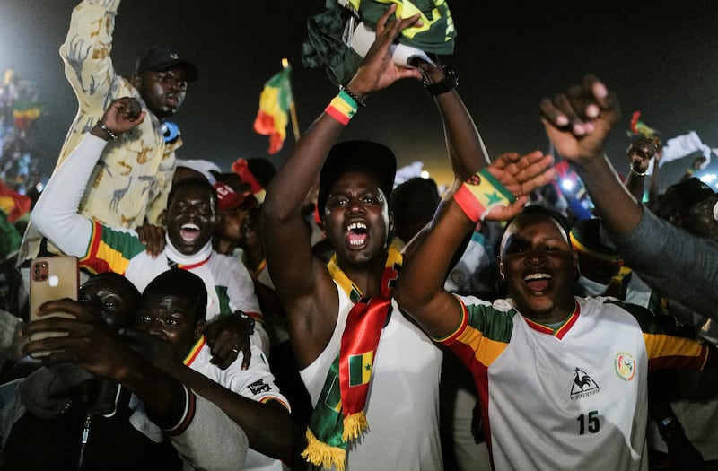 Senegal fans celebrate after winning the Africa Cup of Nations 2021 final in Dakar, Senegal. Reuters