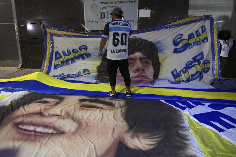 Large banners of Diego Maradona are placed outside the hospital where he undergoes a brain surgery for a blood clot, in Olivos, Buenos Aires. AFP