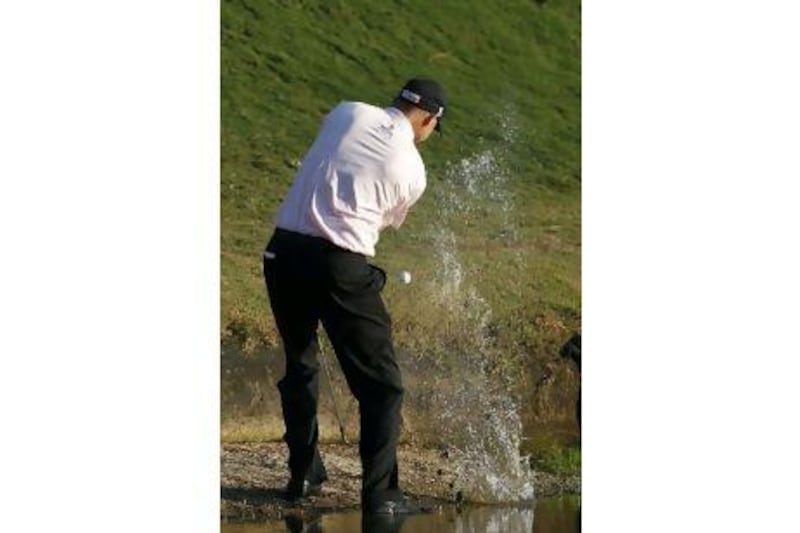 Bill Haas hits from the water on the 17th hole during a play-off against Hunter Mahan in the Tour Championship.Dave Martin / AP Photo