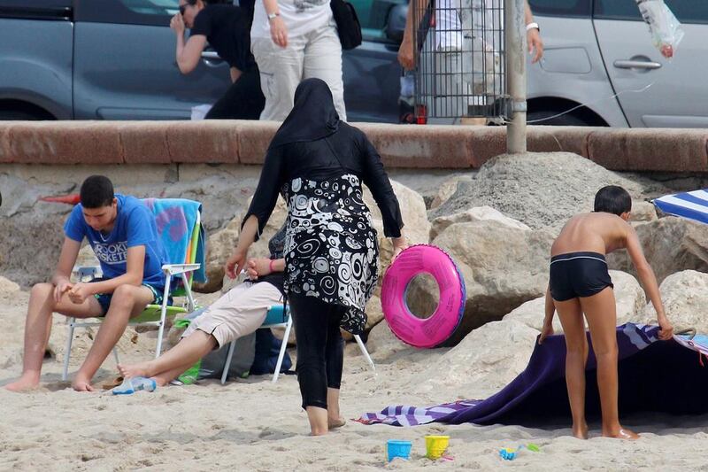 A Muslim woman wears a burqini on a beach in Marseille, France, on August 17, 2016. Reuters