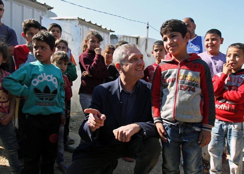 Filippo Grandi meets with Syrian refugee children during his visit to an informal settlement in Mohammara, Akkar Governorate, Lebanon. Reuters