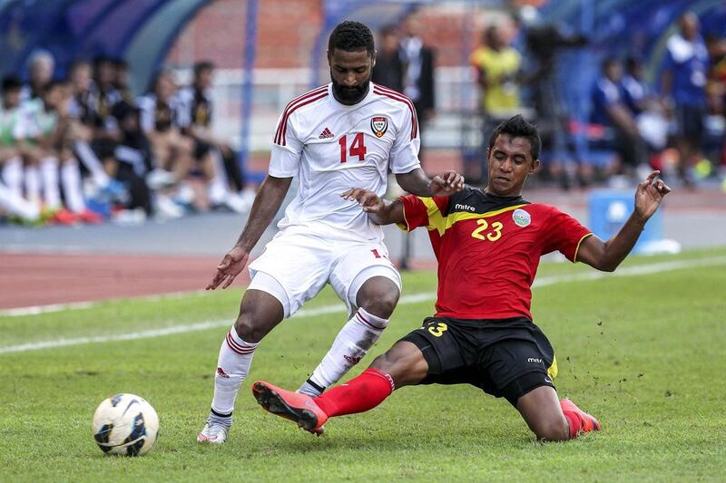 UAE’s Abdelaziz Sangour (L) in action against Timor Leste player Jose Carlos Da Fonseca (R) during the FIFA World Cup 2018 preliminary qualification match between the UAE and Timnor Leste at Shah Alam Stadium outside Kuala Lumpur, Malaysia, 16 June 2015.  EPA/STR