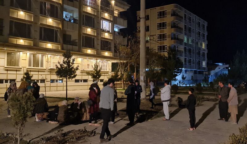 Residents gather at the bottom of their apartment buildings after the 6.5-magnitude earthquake in Kabul, Afghanistan, on March 21. AFP
