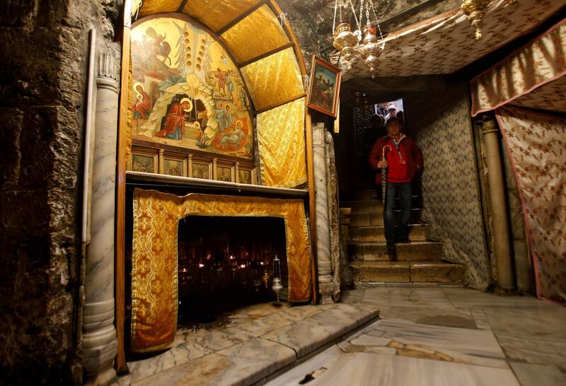A visitor walks in the cave, where Virgin Mary is believed to have given birth to Jesus, inside the Church of the Nativity in the West Bank town of Bethlehem December 12, 2017. Picture taken December 12, 2017. REUTERS/Mussa Qawasma