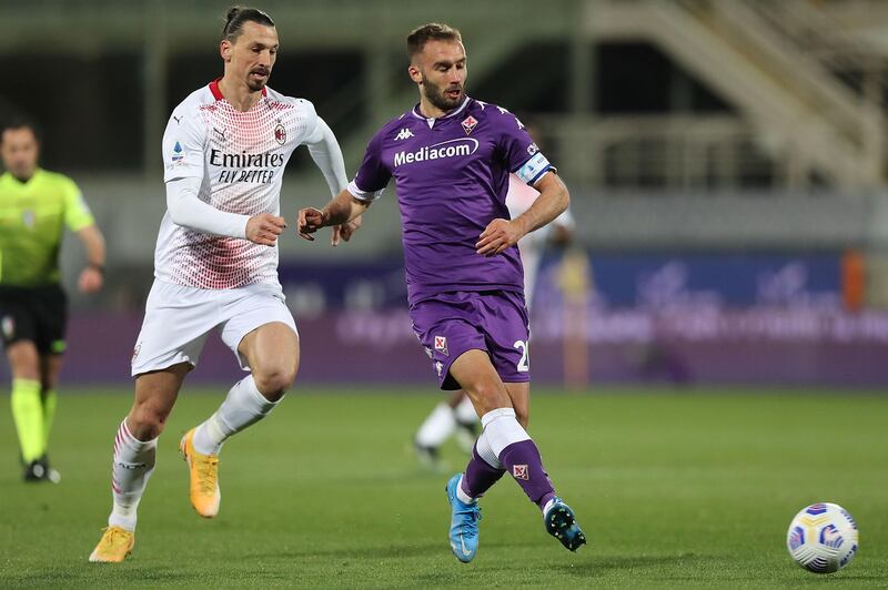 Zlatan Ibrahimovic of AC Milan in action against German Pezzella of Fiorentina. Getty