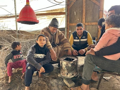 The Samours found shelter from the cold and Israeli missiles in an empty chicken coop in southern Al Mawasi. Mohamed Soulaimane for The National