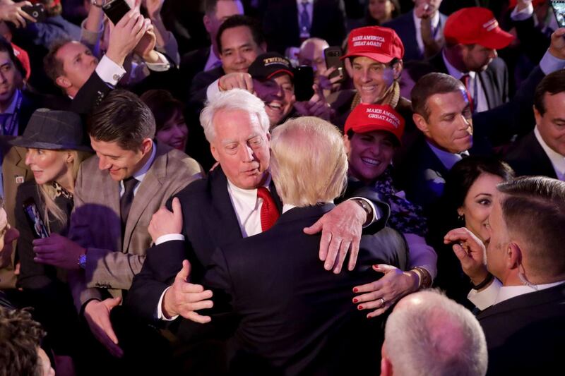 Donald Trump hugs his brother Robert Trump after delivering his acceptance speech in New York City, November 09, 2016.   AFP