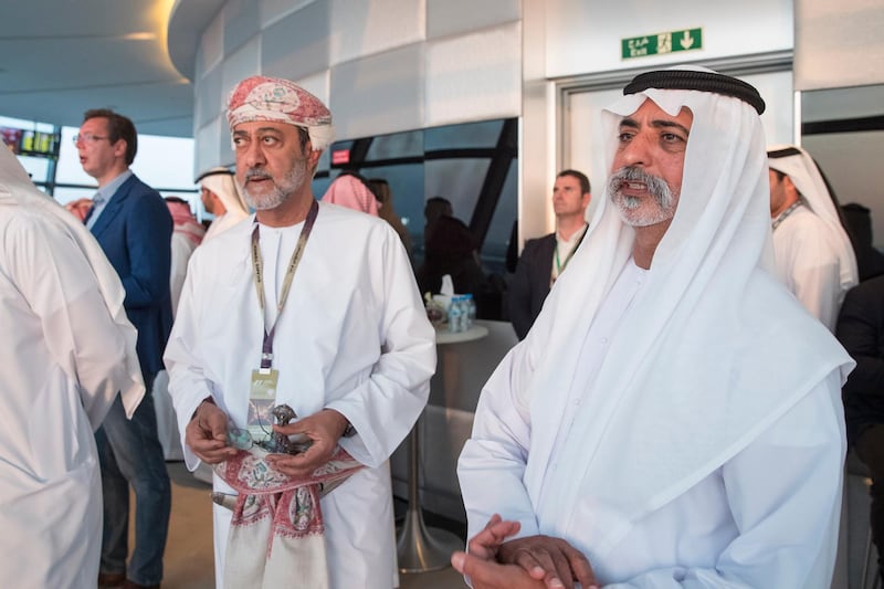 YAS ISLAND, ABU DHABI, UNITED ARAB EMIRATES - November 25, 2016: HH Sheikh Nahyan bin Mubarak Al Nahyan, UAE Minister of Culture and Knowledge Development (R) and HH Sayyid Haitham bin Tariq al Said, Minister of Heritage & Culture of Oman (L) attend the final day of Formula 1 Etihad Airways Abu Dhabi Grand Prix, in Shams Tower.
( Ryan Carter / Crown Prince Court - Abu Dhabi )
--- *** Local Caption ***  20161127RC_C164131.jpg