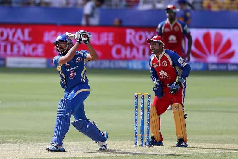 Rohit Sharma, left, stayed long enough to make his knock of 59 runs matter for Mumbai Indians compared to cameos from Royal Challengers Bangalore batsmen such as Parthiv Patel, right. Pawan Singh / The National 