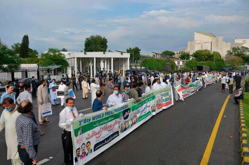 Journalists stand maintaining social distancing in a demonstration to mark the World press freedom day during a government-imposed nationwide lockdown as a preventive measure against the coronavirus, in Islamabad. AFP
