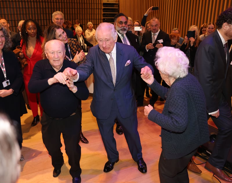 King Charles dances at a pre-Chanukah reception hosted on site for Holocaust survivors at the JW3 Community Centre in December 2022 in London