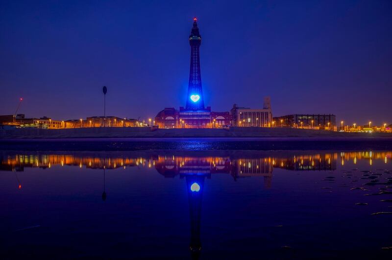 Blackpool Tower in northern England is lit with a blue heart to honour health workers. Getty Images