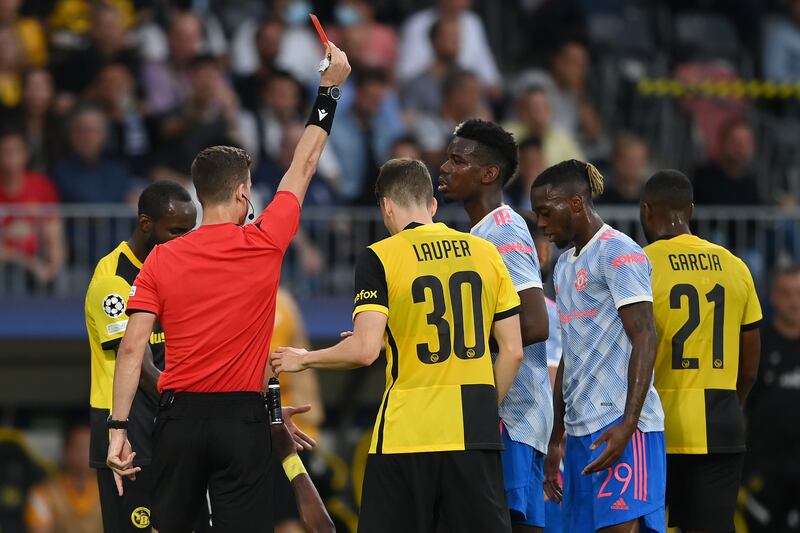 Referee Francois Letexier shows United full-back Aaron Wan-Bissaka a red card. Getty