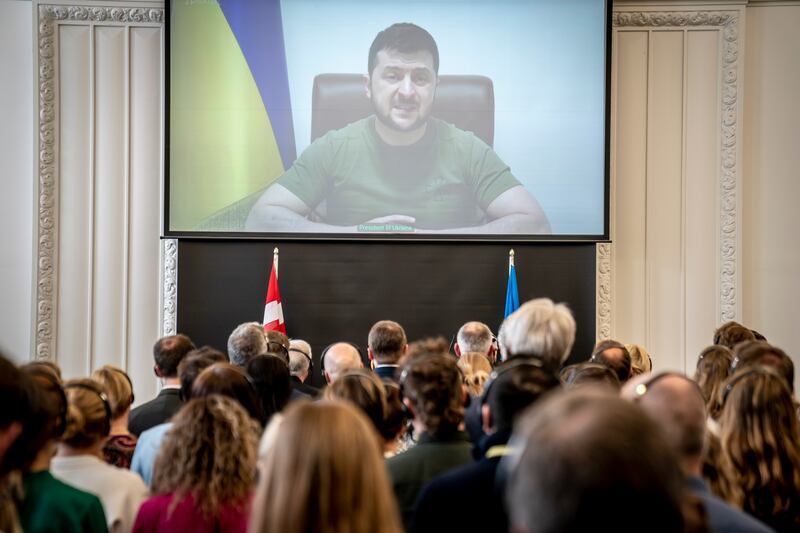 Members of the Danish Parliament attend the Ukrainian President, Volodymyr Zelensky's speech to the Danish Parliament via a video link, at the Christiansborg Castle in Copenhagen, Denmark. EPA