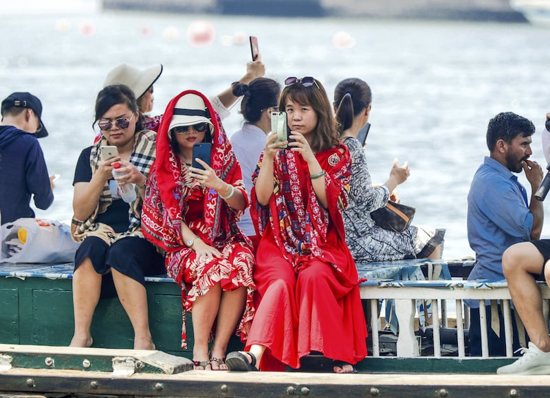 Dubai residents and tourists take the Abra boat to cross the Dubai Creek from the Bur Dubai Souk to the Gold Souq. Victor Besa/The National