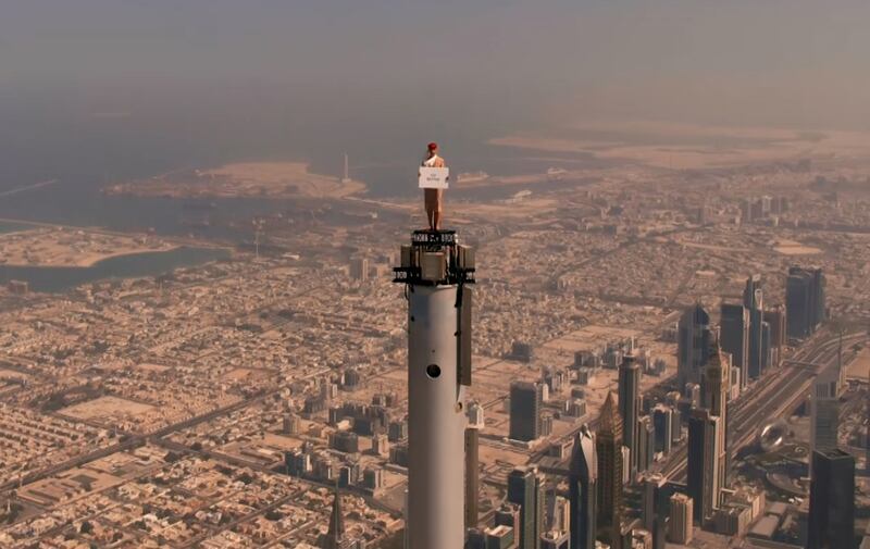 A promotional video from Emirates welcomed visitors to Dubai with a flight attendant on top of Burj Khalifa. Photo: Emirates