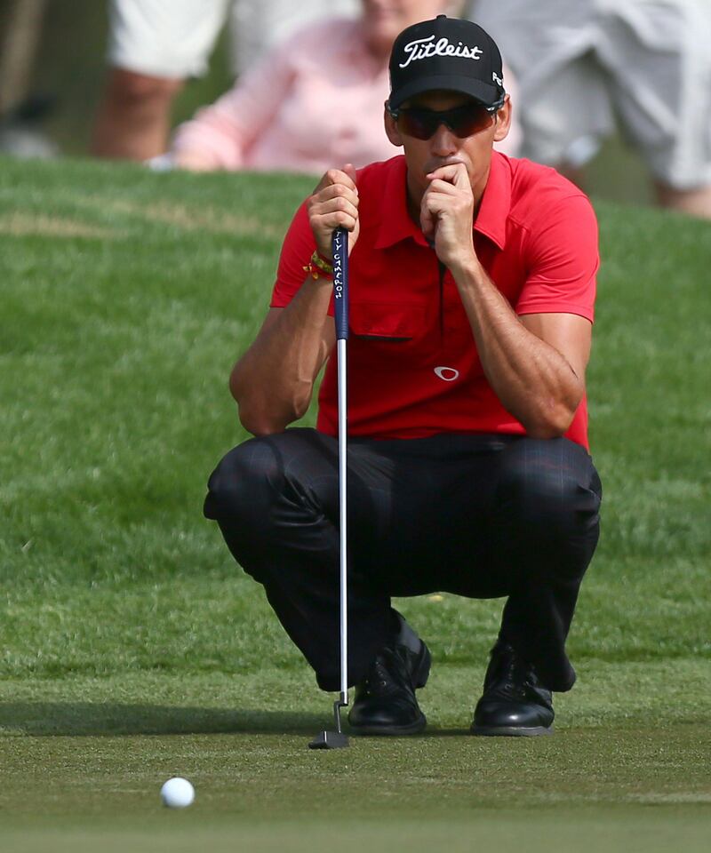 Rafa Cabrera-Bello of Spain lines up his shot during the second round of the Dubai Desert Classic golf tournament in the Gulf emirate of Dubai on February 1, 2013. AFP PHOTO/MARWAN NAAMANI
 *** Local Caption ***  391812-01-08.jpg