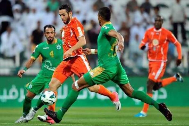 Driss Fettouhi, second from left, scored one of Ajman's goals. Al Ittihad