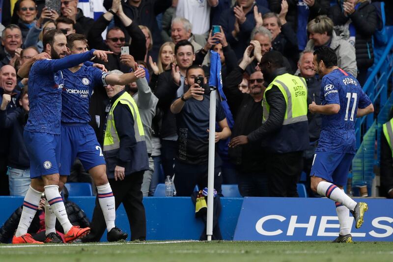 Chelsea's Gonzalo Higuain, left, celebrates with teammate Cesar Azpilicueta, center, and Pedro. AP Photo