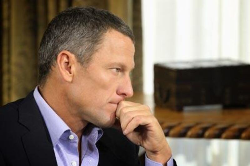 Lance Armstrong listens as he is interviewed by talk show host Oprah Winfrey during taping for the show "Oprah and Lance Armstrong: The Worldwide Exclusive" .