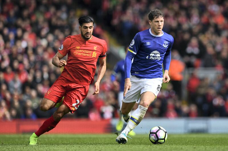 Everton's English midfielder Ross Barkley (R) vies with Liverpool's German midfielder Emre Can during the English Premier League football match between Liverpool and Everton at Anfield in Liverpool, north west England on April 1, 2017. / AFP PHOTO / Paul ELLIS / RESTRICTED TO EDITORIAL USE. No use with unauthorized audio, video, data, fixture lists, club/league logos or 'live' services. Online in-match use limited to 75 images, no video emulation. No use in betting, games or single club/league/player publications.  / 