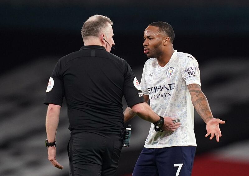 City's Raheem Sterling argues with referee Jonathon Moss. Reuters