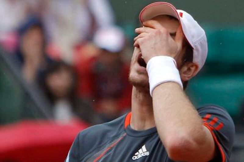 Britain's Andy Murray reacts as he plays Spain's David Ferrer during their quarterfinal match in the French Open tennis tournament at the Roland Garros stadium in Paris, Wednesday, June 6, 2012.  (AP Photo/Michel Spingler)