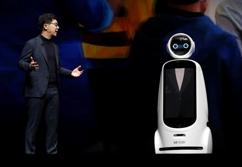IP Park, president and chief technical officer for LG Electronics, speaks with a LG CLOi robot. Reuters