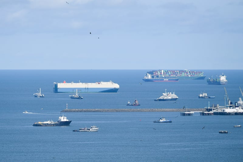 Cargo ships wait in the Pacific Ocean to pass though the Panama Canal, seen from Panama City.  AP Photo