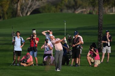 DUBAI, UNITED ARAB EMIRATES - JANUARY 29:   Justin Harding of South Africa hits his third shot on the 18th hole during day three of the Slync.io Dubai Desert Classic at Emirates Golf Club on January 29, 2022 in Dubai, United Arab Emirates. (Photo by Ross Kinnaird / Getty Images)