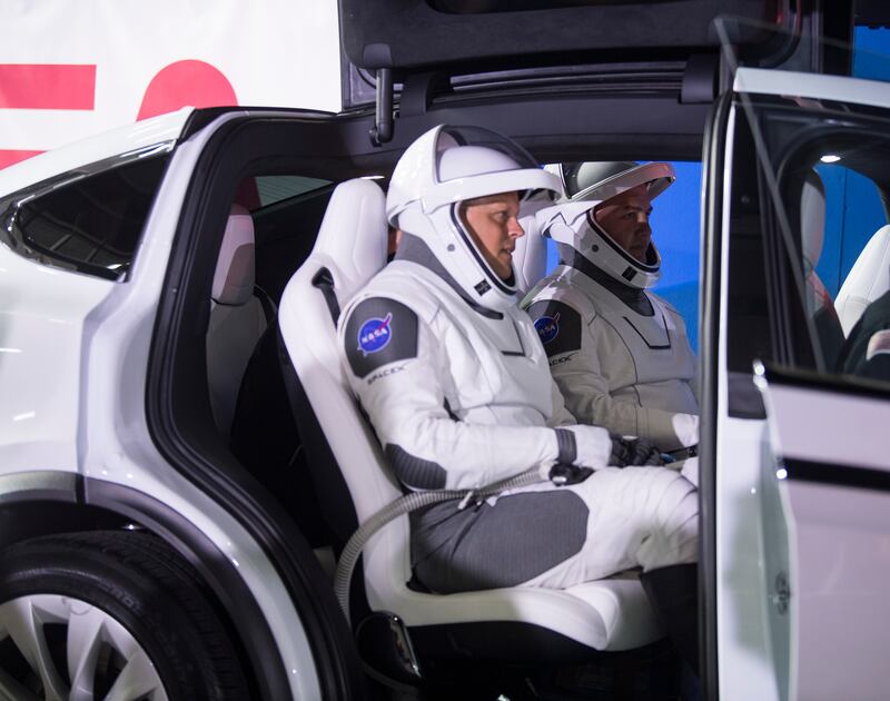 The crew inside a Tesla vehicle that will transport them to the launch pad in Florida. EPA 