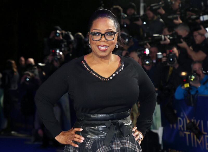 Former first lady Michelle Obama paid homage to Oprah Winfrey, seen here at a 2018 film premiere in London, for having an 'uncanny ability to open us up, to hear beyond our words, and to uncover a higher truth'. AP