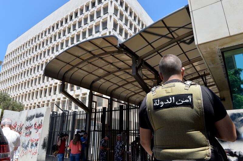 Lebanese security personnel raid the Banque du Liban, the country's central bank, in Beirut. EPA