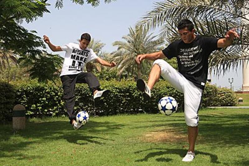 Mohammad Sa’adeh, right, and Mustafa ‘Loco’ Daroghmeh demonstrate their freestyle routine with the trick “keepy uppy”.