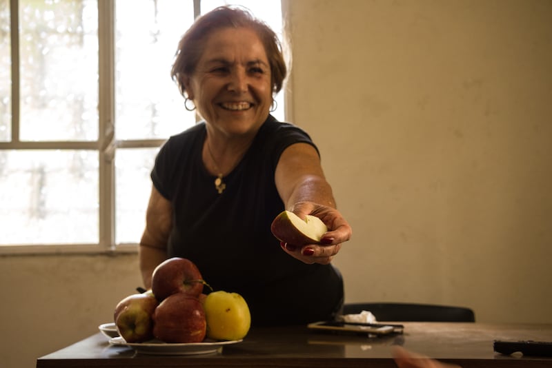 Therese Comair offers apples grown in her orchard in the village of Tannourine, an hour-and-a-half’s drive north-east of Beirut. Picture: Elizabeth Fitt