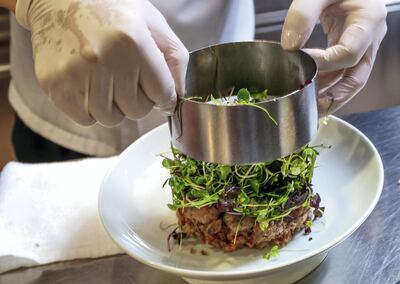 Abu Dhabi, UAE.  March, 12,  2018. Hakkasan Executive Chef, Lee Kok Hua, demonstrates on how to make Crispy Duck Salad.
Victor Besa / The National
Weekend
Reporter:  Mel Healy