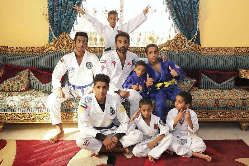 ABU DHABI, UNITED ARAB EMIRATES , April 22– 2020 :- Khaled Al Awlaqi, former Jiu Jitsu player with his seven sons Mahdi (17), Faraj (15), Mohammed (14), Altheeb (8), Mubarak (6), Abdullah (6) and Omar (5) at his home in Baniyas area in Abu Dhabi.  (Pawan Singh / The National) For Sports/Online. Story by Amith