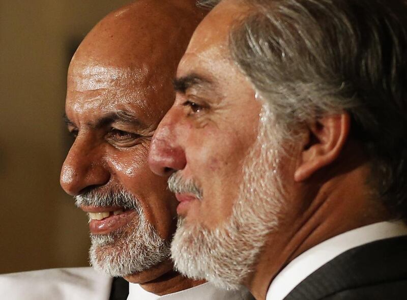Ashraf Ghani, left, and Abdullah Abdullah address a news conference in Kabul on July 12, 2014. Mohammad Ismail / Reuters
